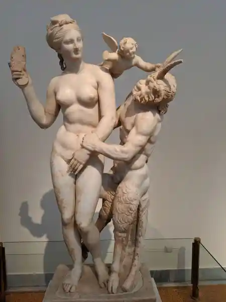 Marble statue group of Aphrodite fending off Pan with help from Eros